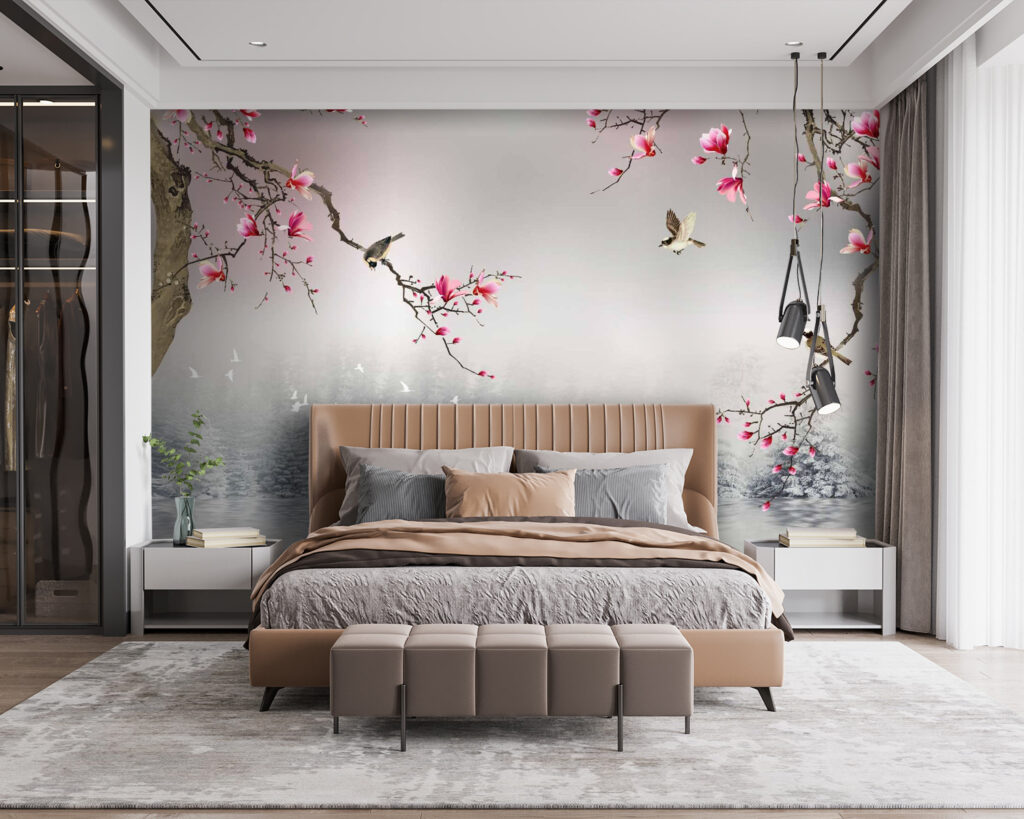 Tree branches with pink flowers and birds flying over water