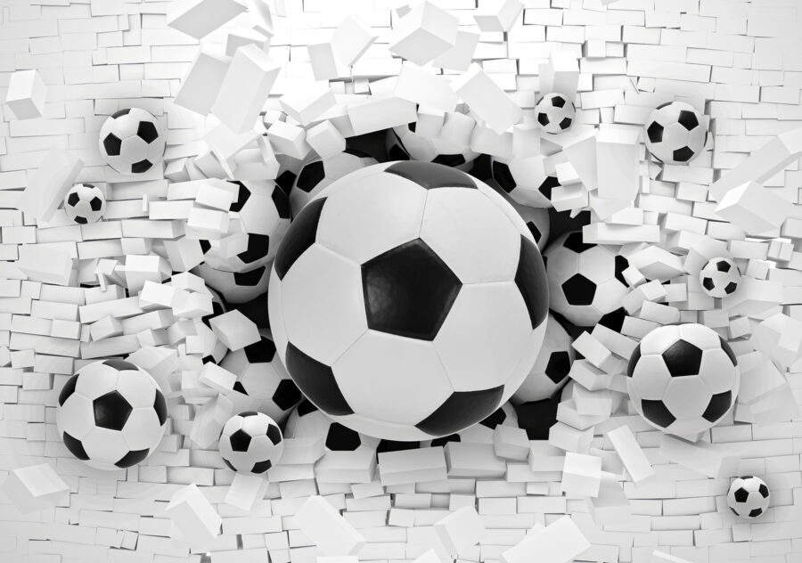 Grupa piłek futbolowych w stosie cegieł