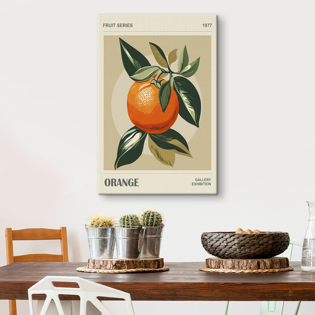 An orange with leaves on a branch An orange with leaves on a branch