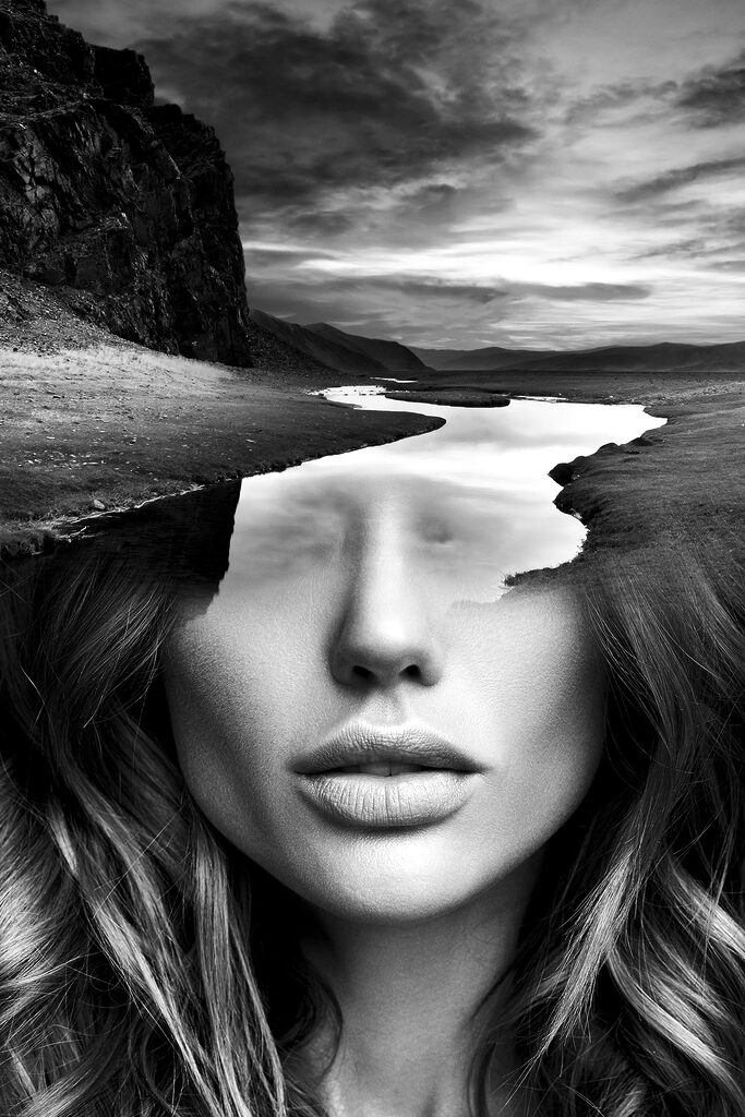 A woman's face with a river and mountains