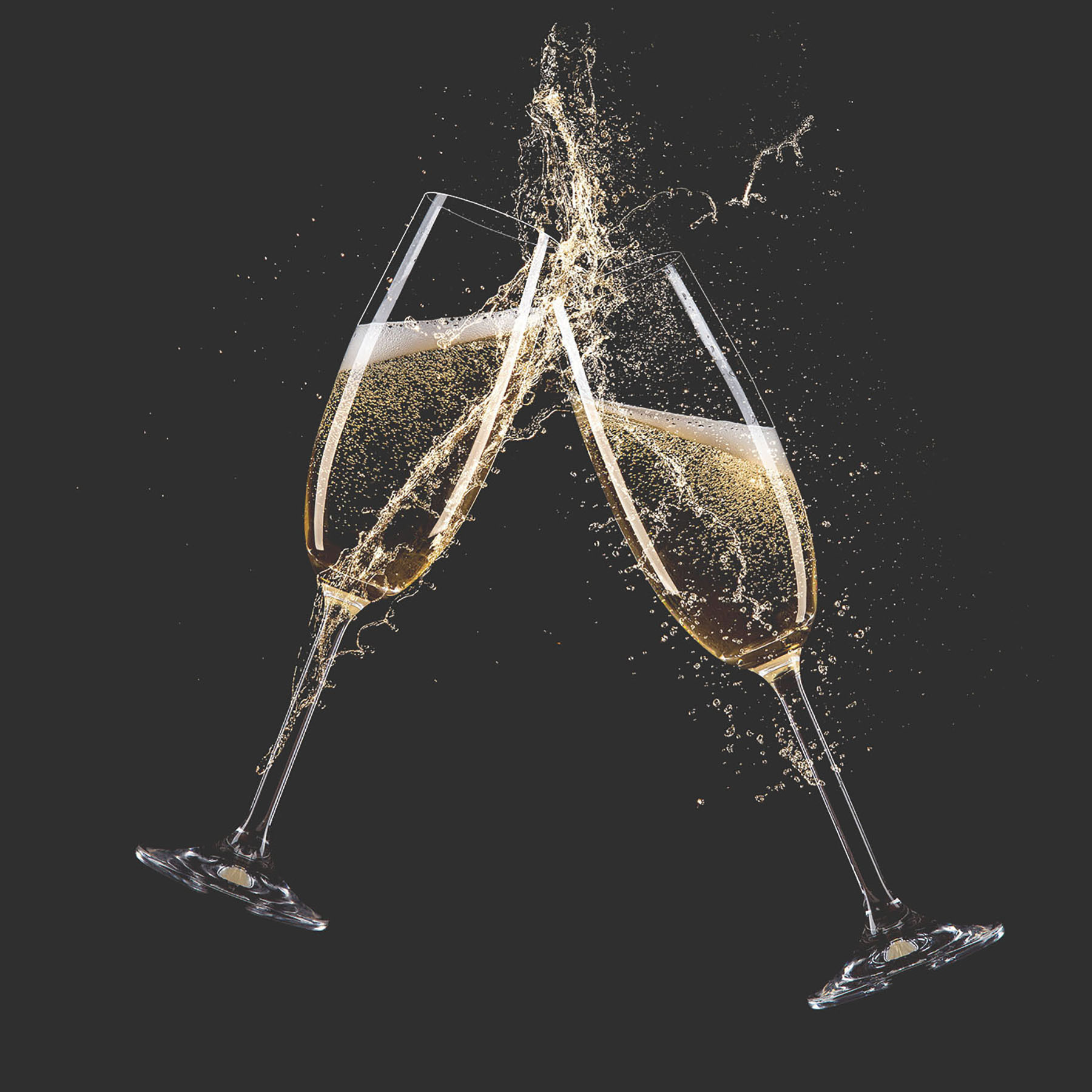 Two glasses of champagne with splashing liquid