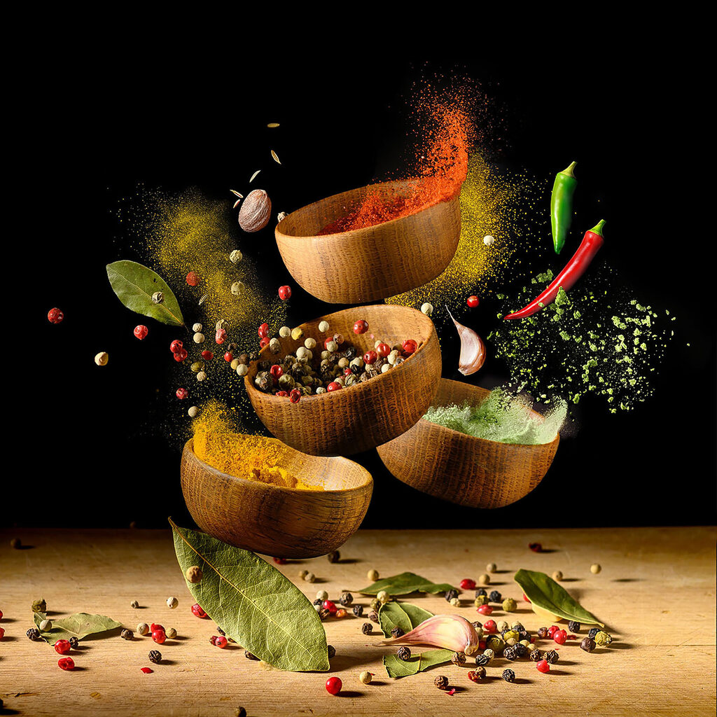 A group of bowls with spices and herbs