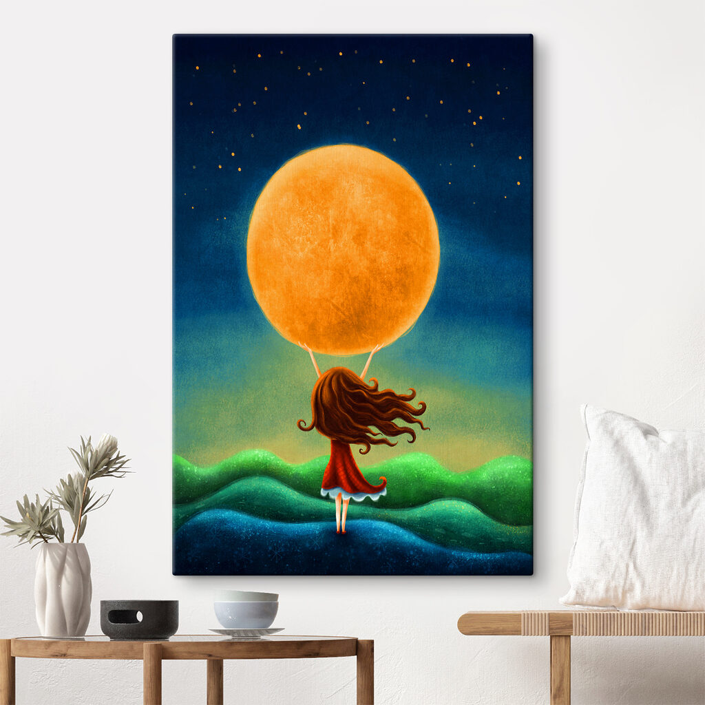 A girl holding a large yellow moon