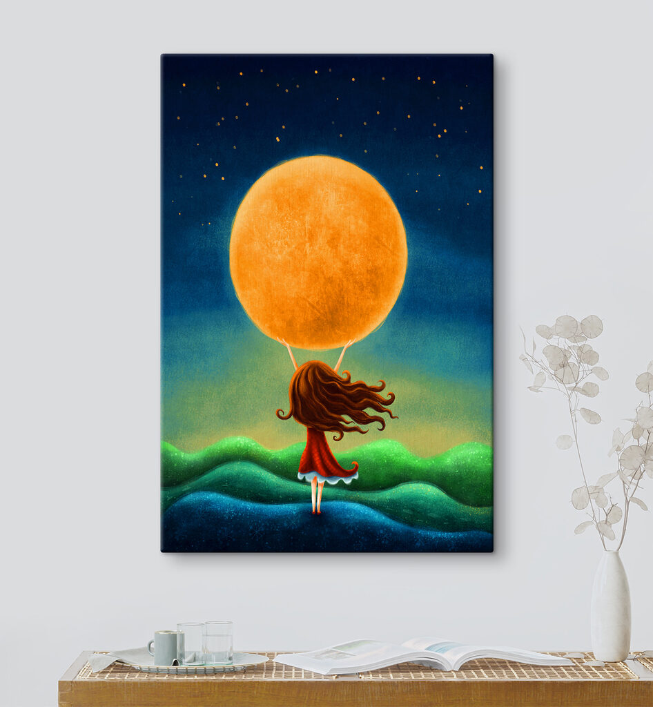A girl holding a large yellow moon