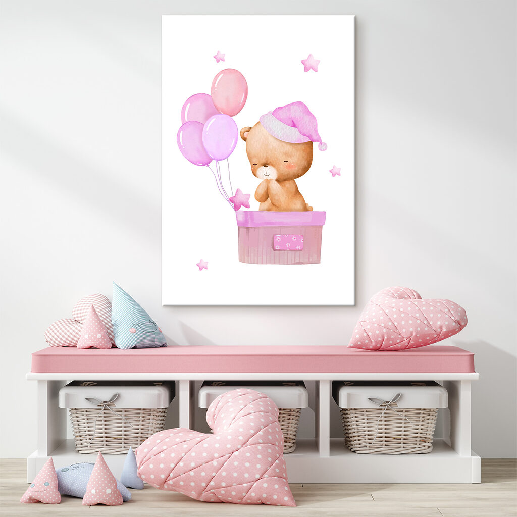 A teddy bear in a basket with balloons