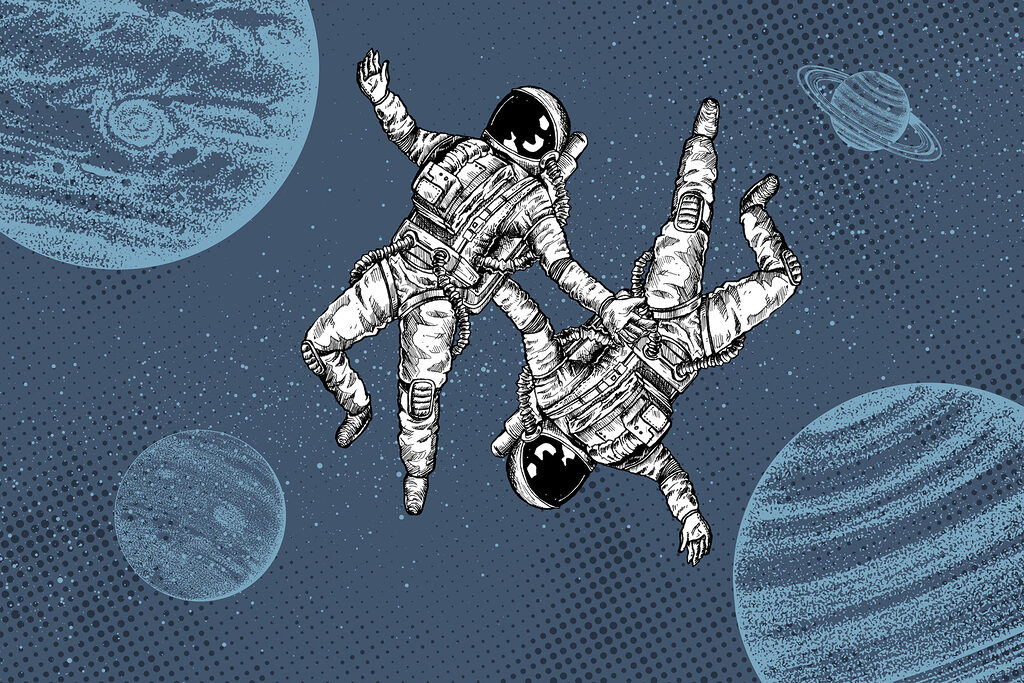 Dwóch astronautów unoszących się w przestrzeni kosmicznej Dwóch astronautów unoszących się w przestrzeni kosmicznej
