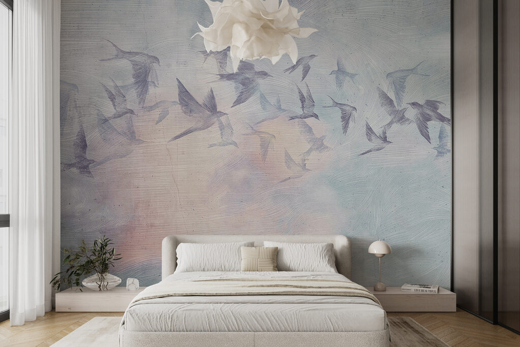 A flock of birds flying in the sky