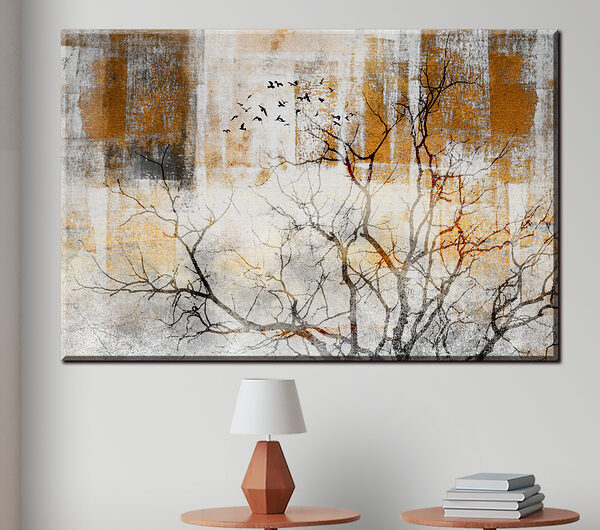 A tree with birds flying in the sky
