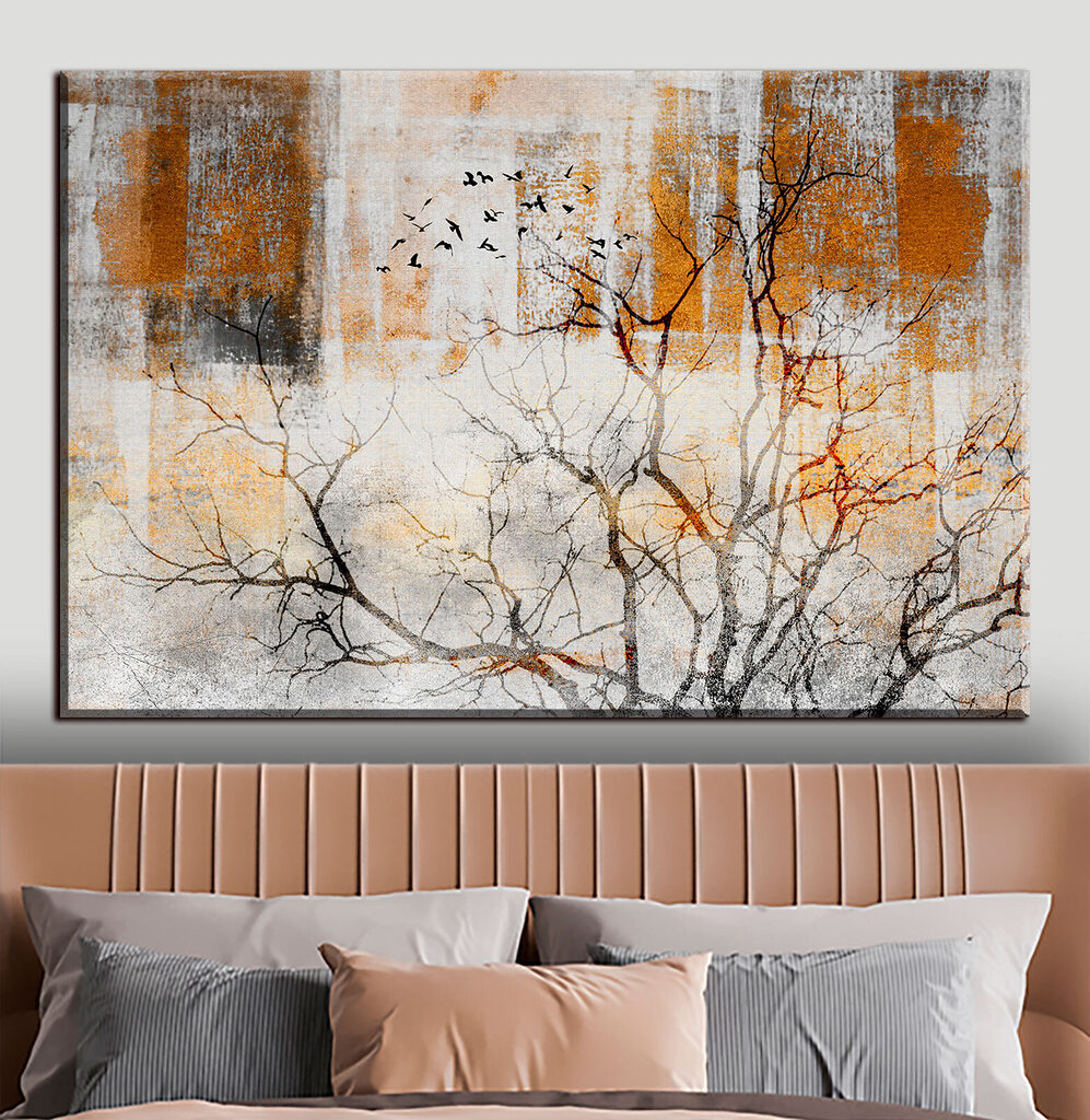 A tree with birds flying in the sky