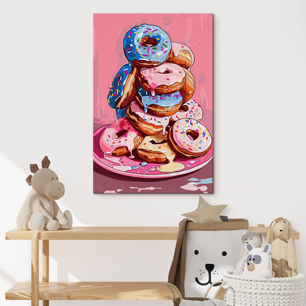 A stack of donuts with frosting and sprinkles