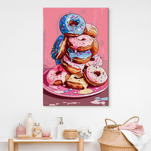 A stack of donuts with frosting and sprinkles