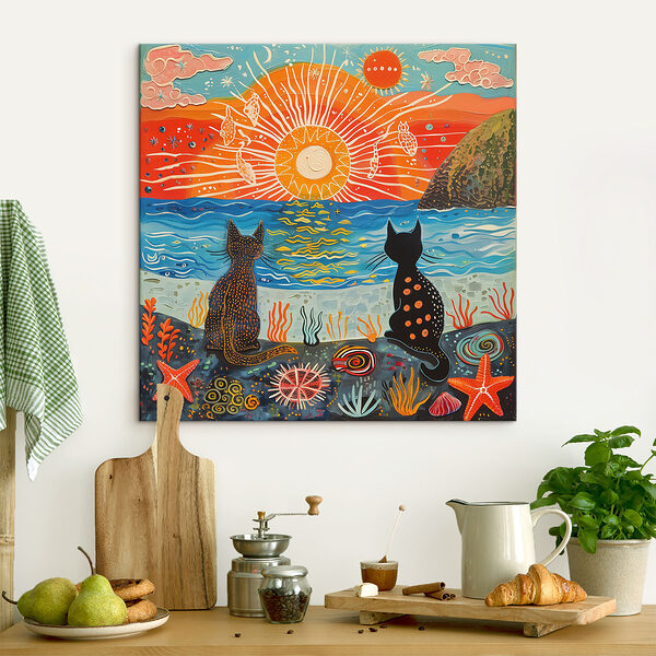 Two cats sitting on a beach looking at the sun Two cats sitting on a beach looking at the sun