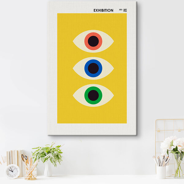 A yellow rectangular object with multi colored eyes A yellow rectangular object with multi colored eyes