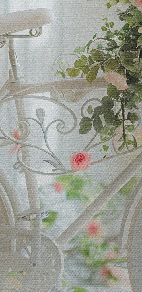 White bicycle with flowers on it