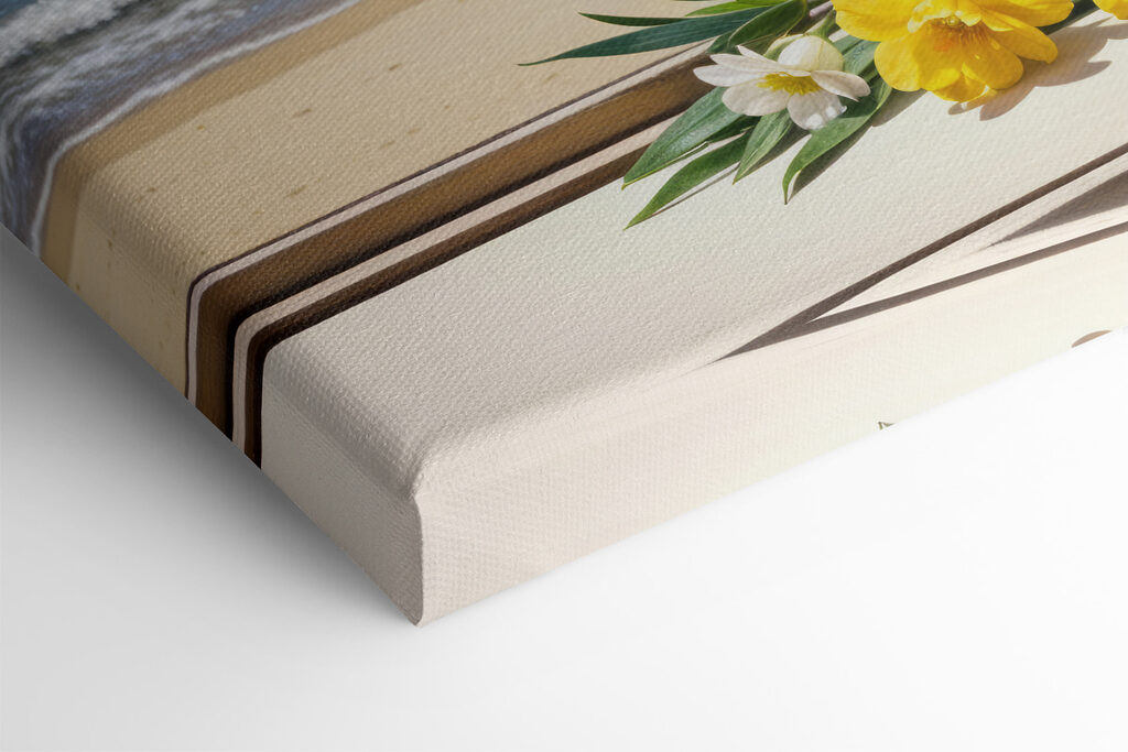 Vase of yellow and white flowers on a window sill