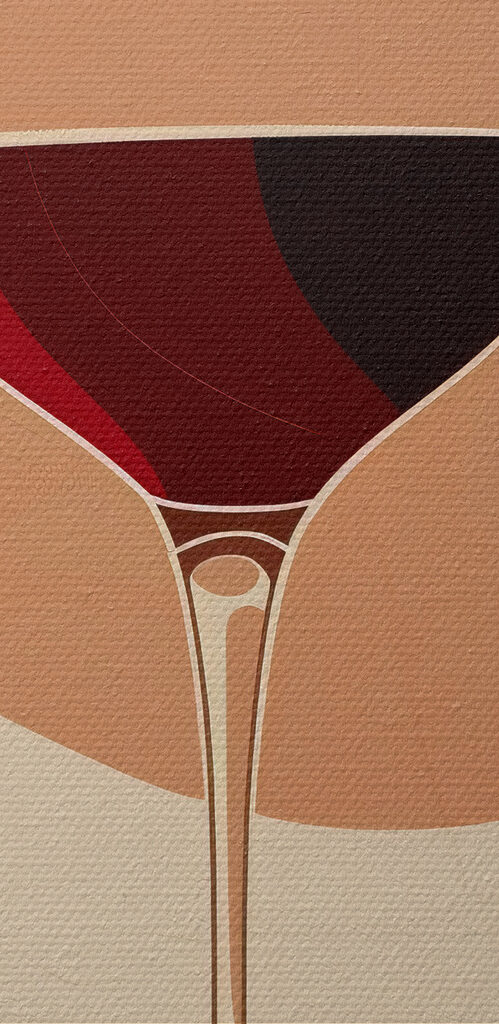 Glass of wine with a red liquid in it Glass of wine with a red liquid in it