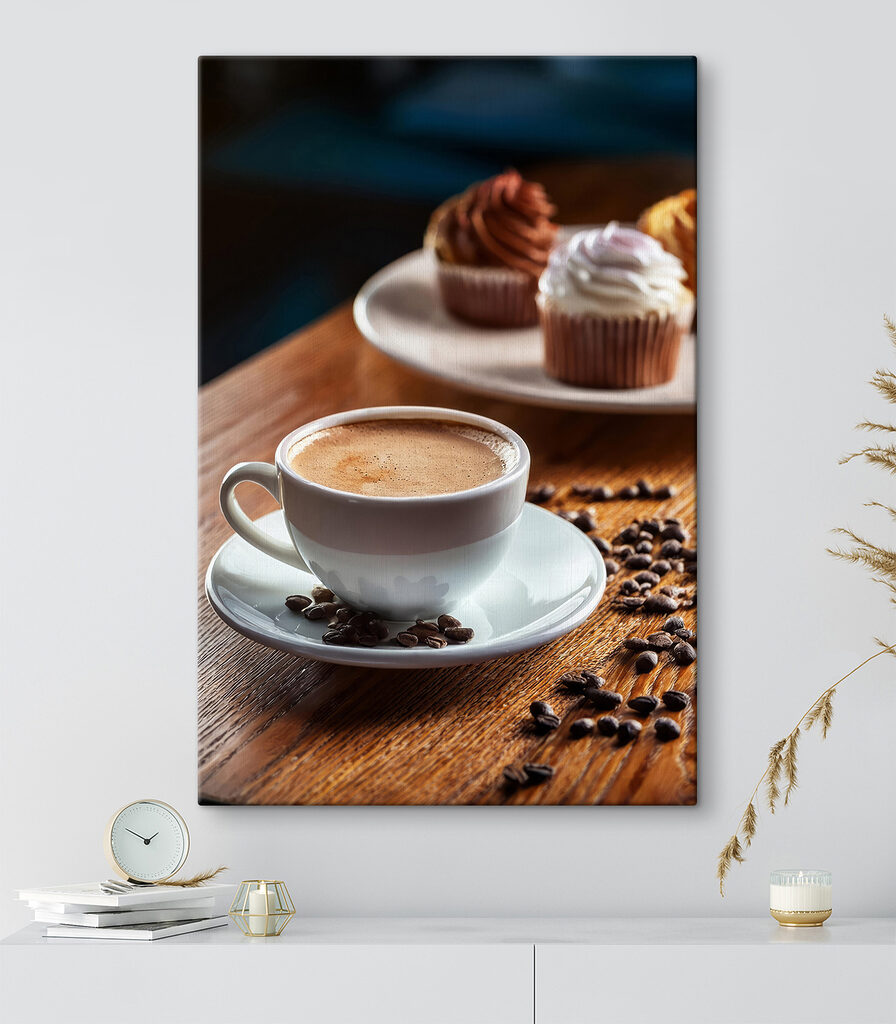 Cup of coffee and cupcakes on a table