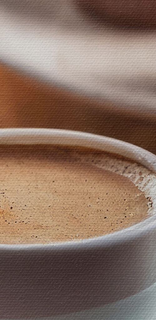 Cup of coffee and cupcakes on a table
