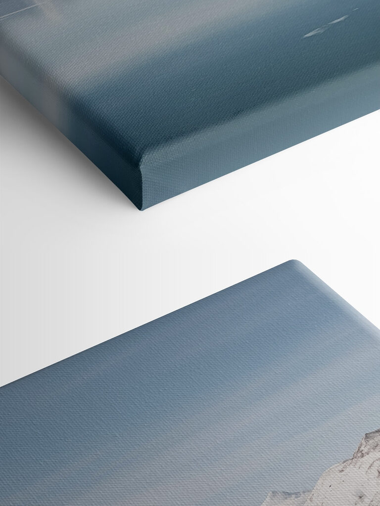 Red house on an island in water with snow covered mountains in the background Red house on an island in water with snow covered mountains in the background