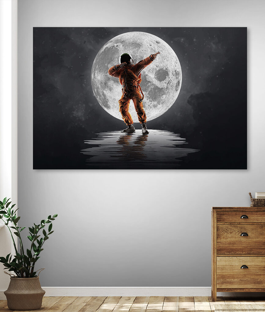 Man in an orange suit standing in front of a full moon
