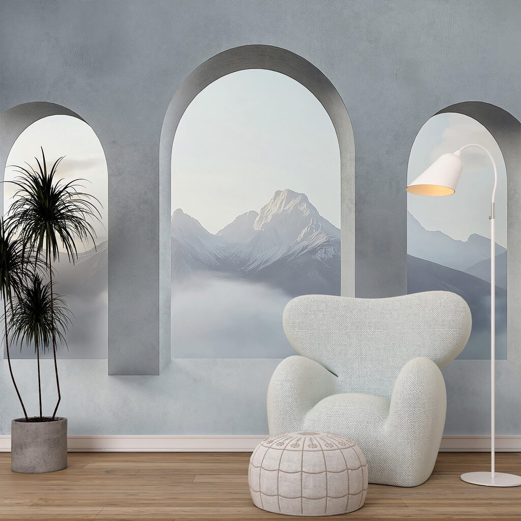White room with arched windows and mountains in the background