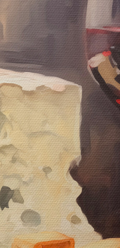 Glass of wine and cheese on a table