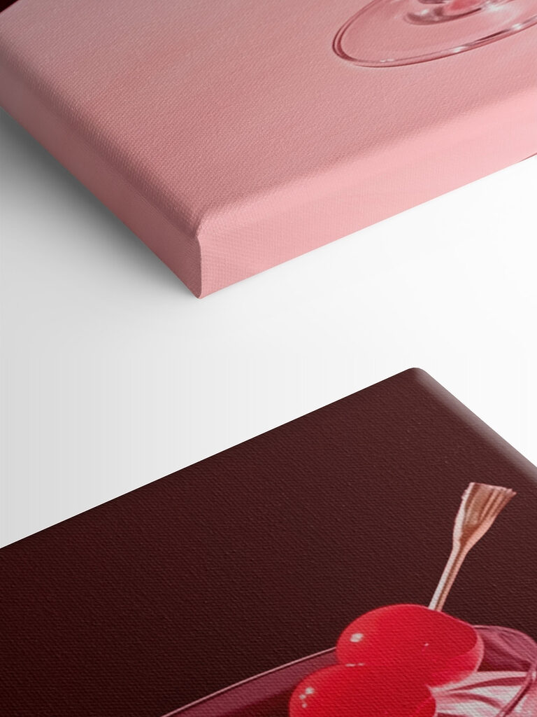 Glass with pink liquid and two cherries on it