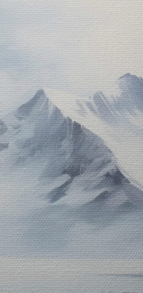 Snowy mountain range and a body of water