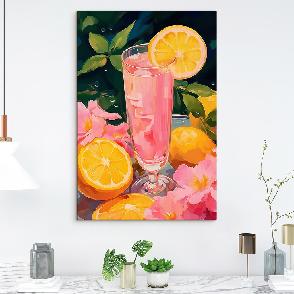 Glass of pink liquid with lemons and flowers