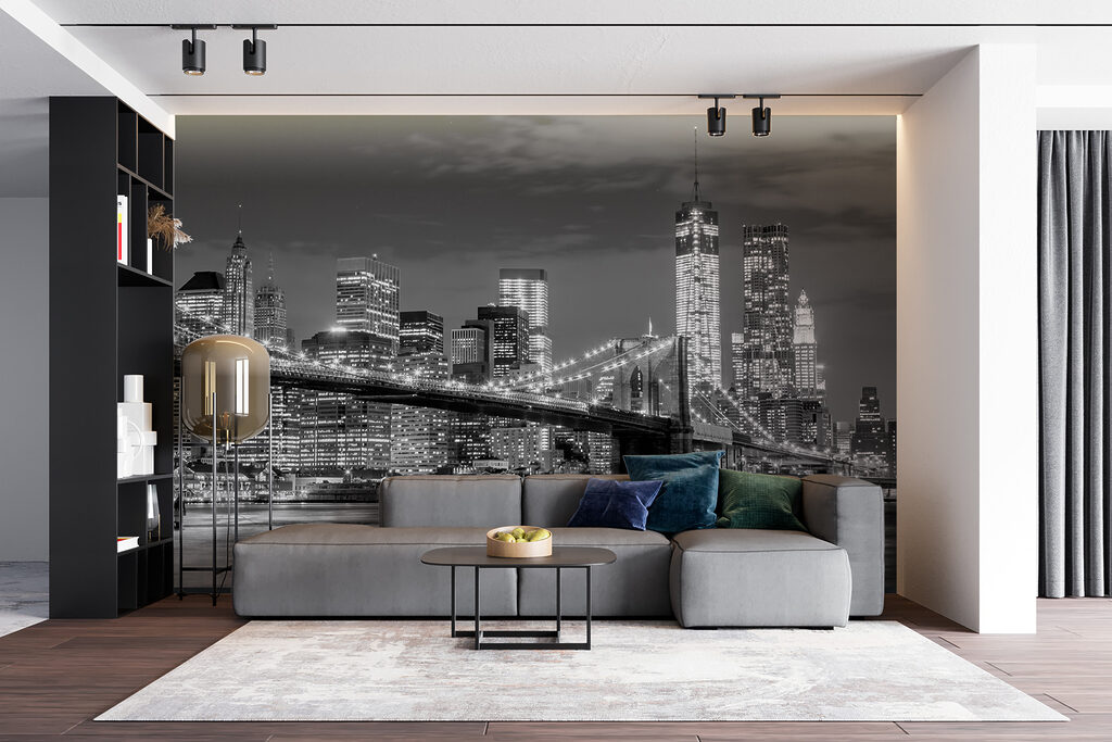 Bridge over water with city skyline at night