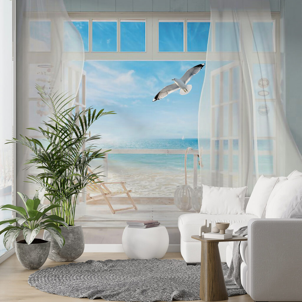 View of a beach from a room with a bird flying over it View of a beach from a room with a bird flying over it