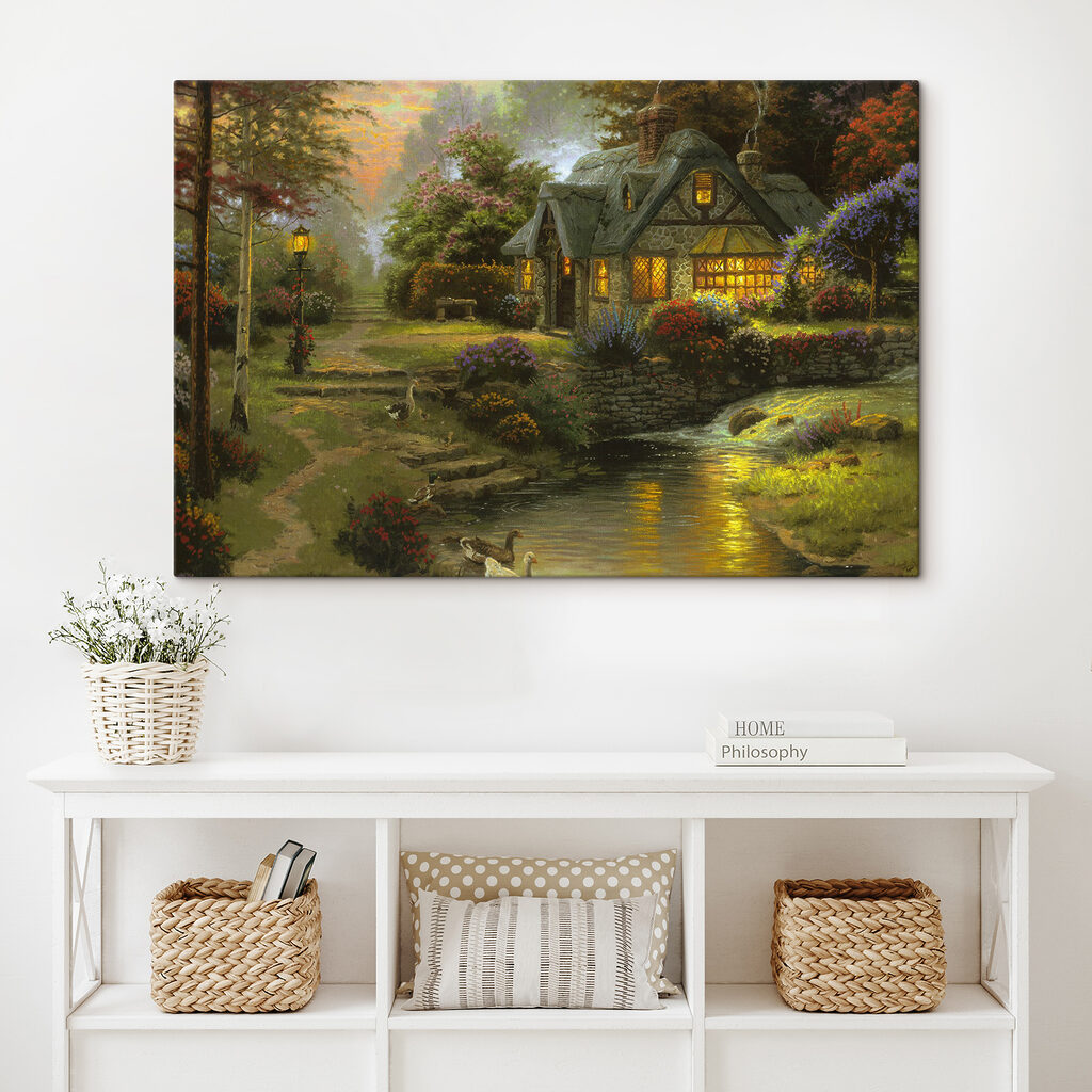 A painting of a cottage by a river