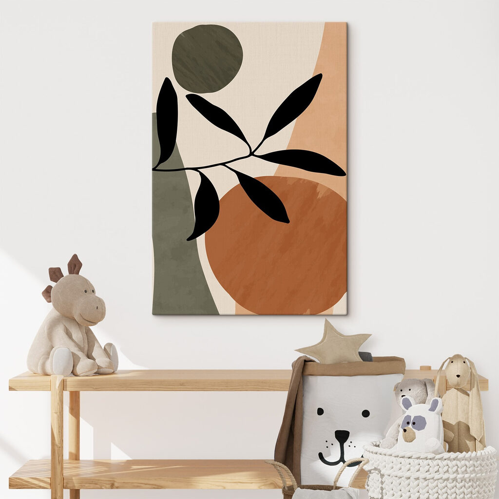 A black leaf on a branch with circles and circles