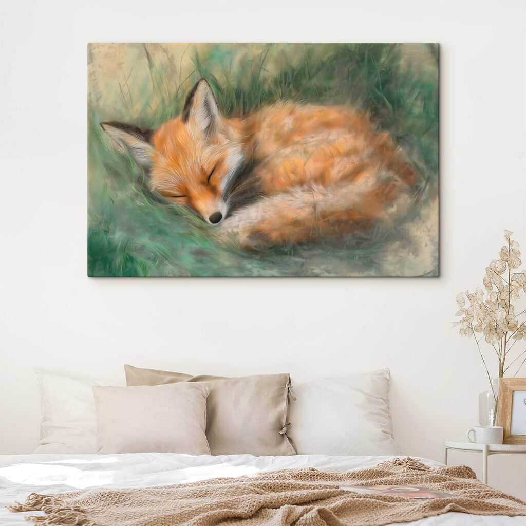 Fox sleeping in the grass