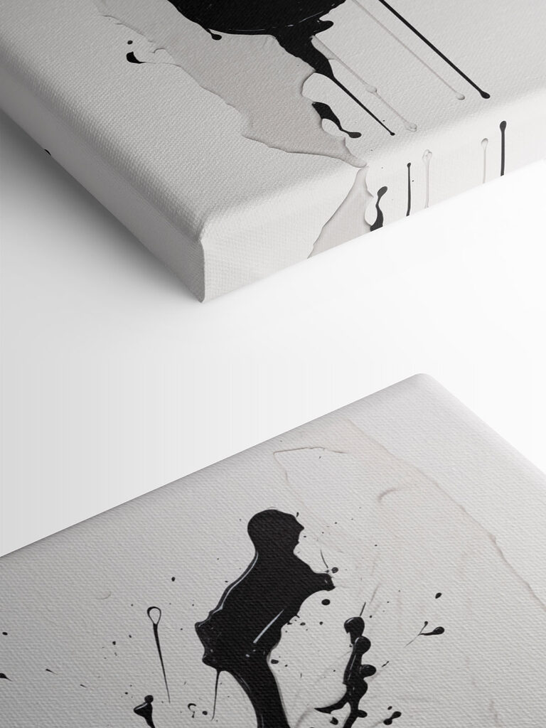 Black and white paint splattered on a white surface