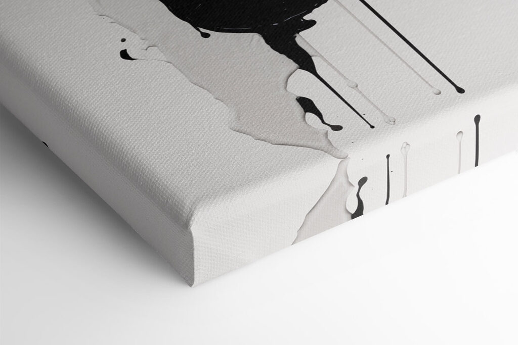 Black and white paint splattered on a white surface