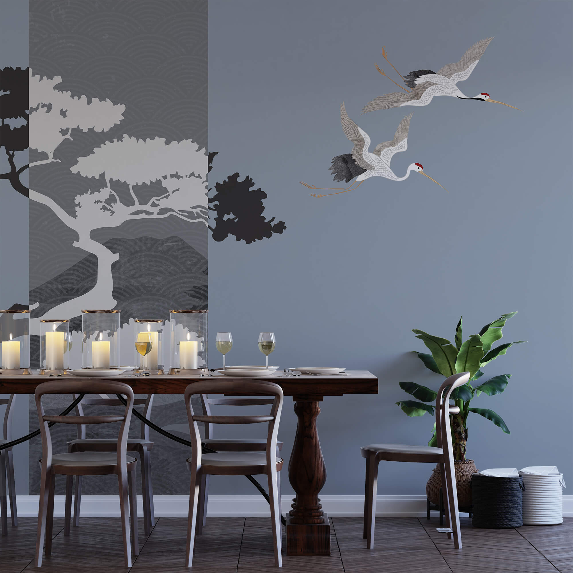 Para żurawi lecących obok drzewa