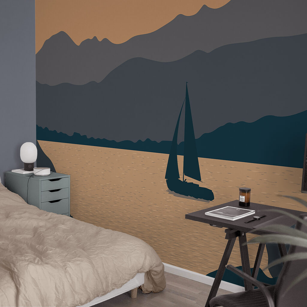 Żaglówka na wodzie z górami w tle