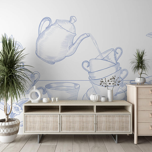 Czajnik nalewający herbatę do stosu filiżanek