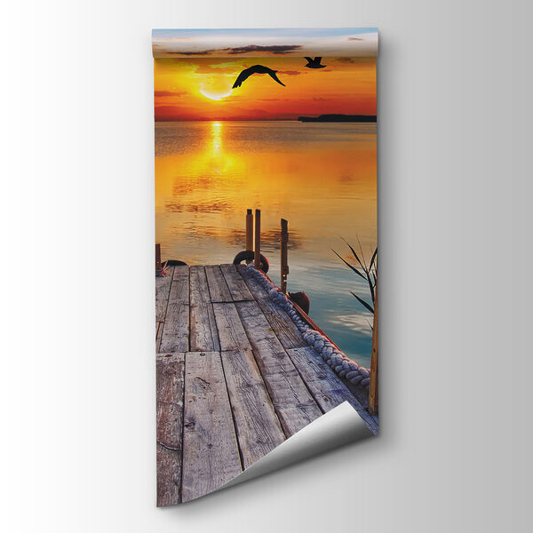 Dock with birds flying over water