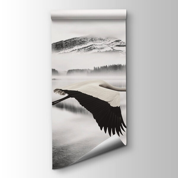 Bird flying over water