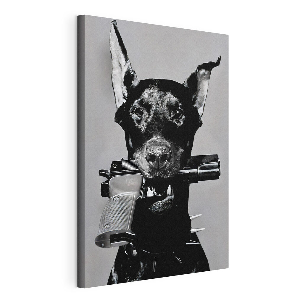 A dog holding a gun