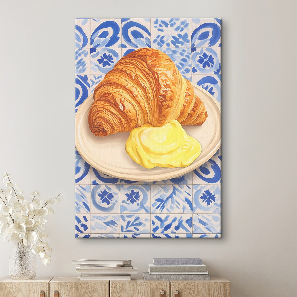 Croissant and a yellow liquid on a plate