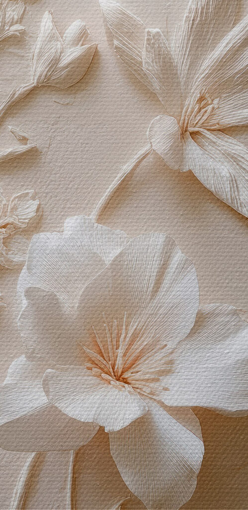 White flower embroidery on a white surface White flower embroidery on a white surface