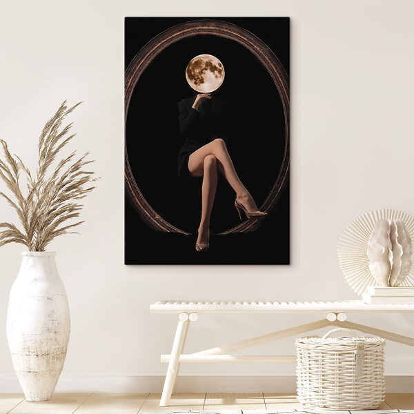 Woman sitting in a chair with a moon in her face Woman sitting in a chair with a moon in her face