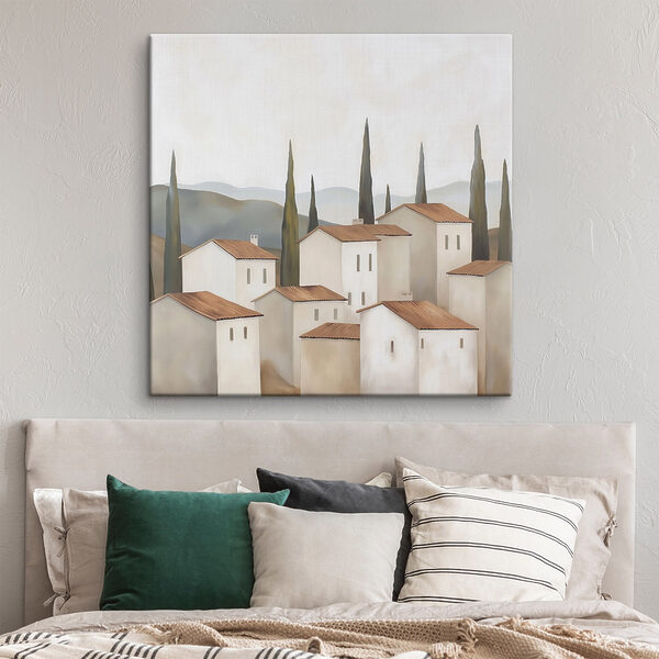Group of white buildings with brown roofs and trees