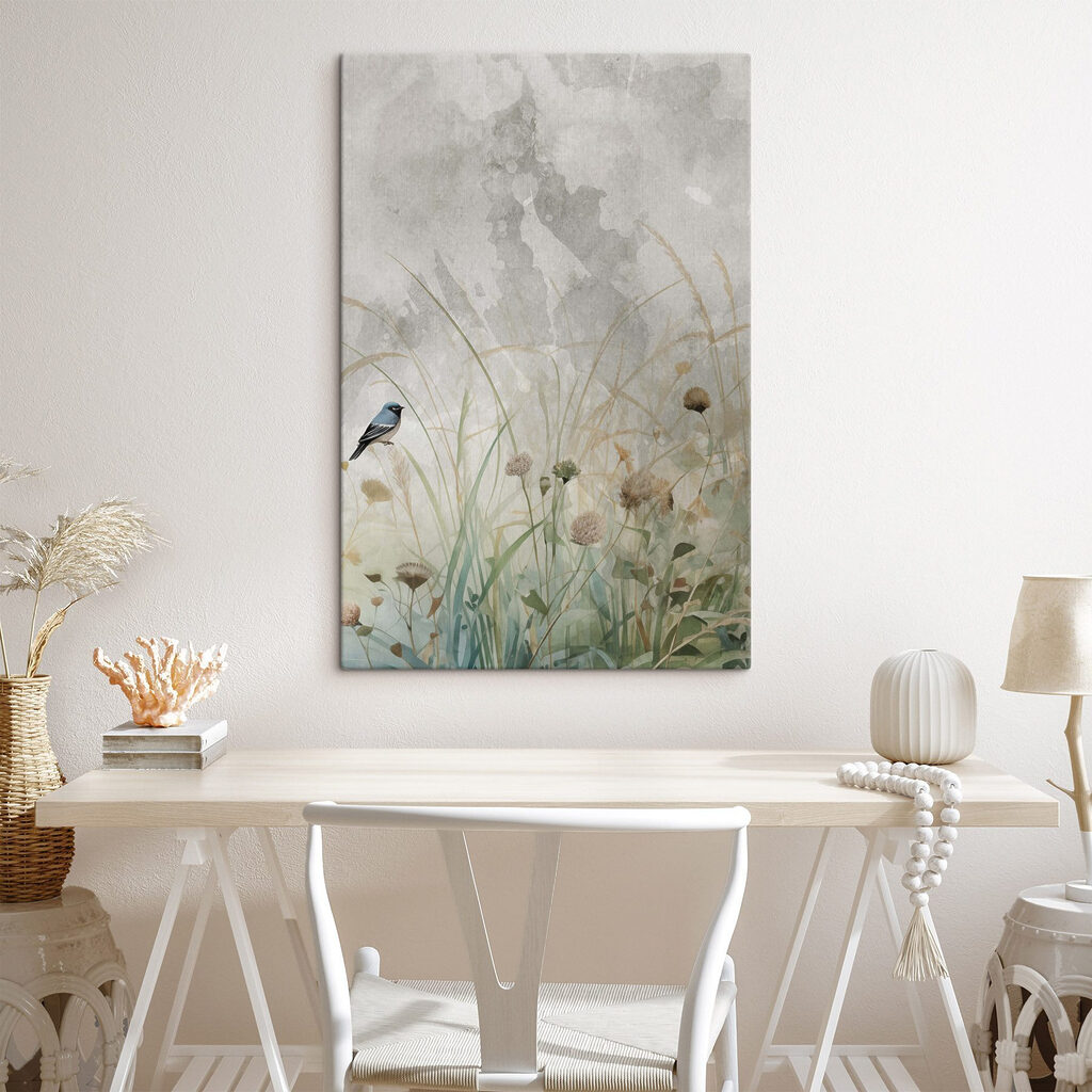 Bird on a branch in a field of grass