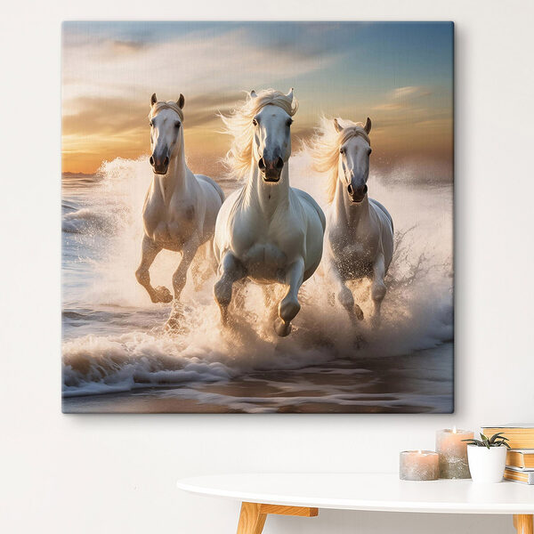 Group of white horses running on a beach Group of white horses running on a beach