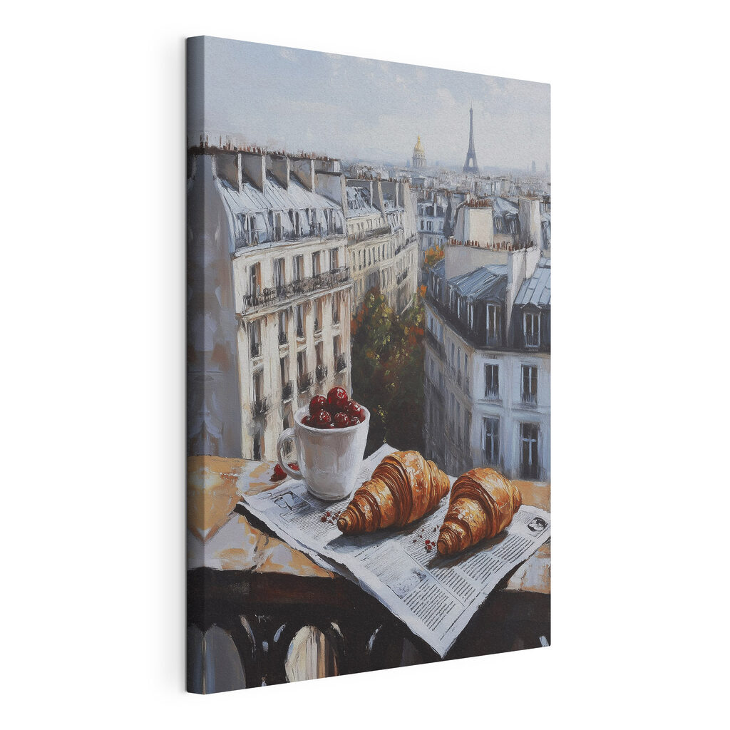 Cup of coffee and croissants on a table with buildings in the background