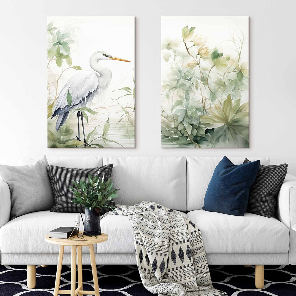 White bird with a long beak and a long beak standing in front of a plant White bird with a long beak and a long beak standing in front of a plant